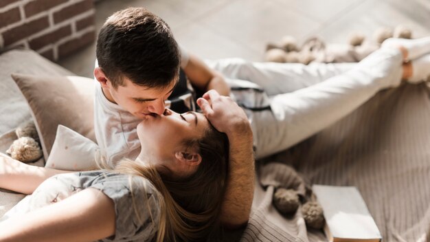 Close-up of a young couple kissing to each other