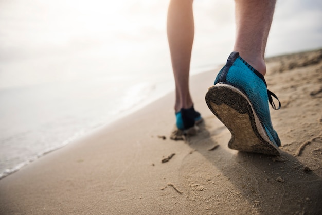 Free Photo close up on young fit person jogging by the sea