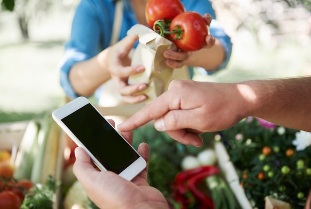 Free Photo close up on young gardener selling products