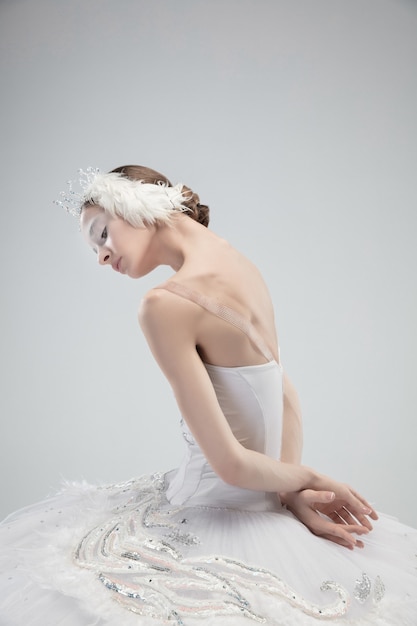 Free Photo close up of young graceful ballerina on white studio background