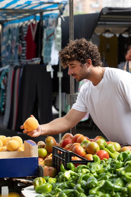 Free photo close up on young man at the food market