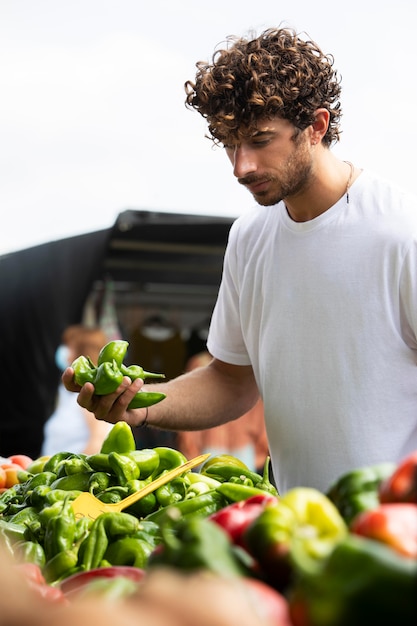 Free photo close up on young man at the food market