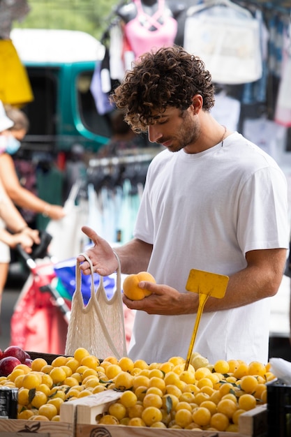 Free photo close up on young man at the food market