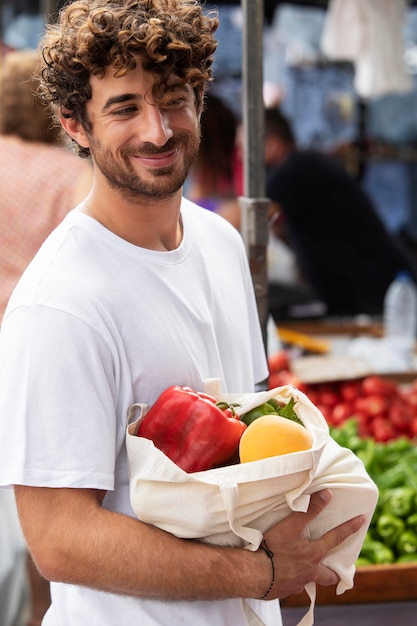 Free Photo close up on young man at the food market