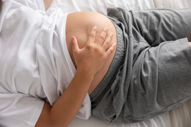 Close up on young pregnant woman sleeping