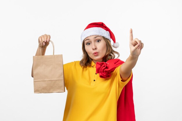 Close up on young pretty woman wearing Christmas hat isolated