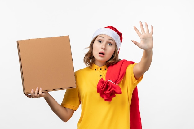 Close up on young pretty woman wearing Christmas hat isolated