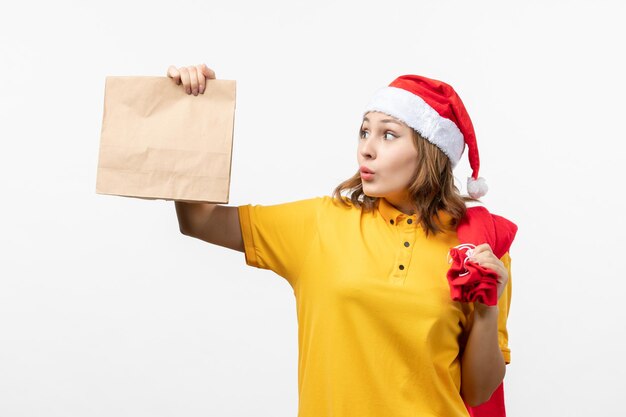 Close up on young pretty woman wearing Christmas hat isolated