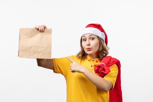 Close up on young pretty woman wearing Christmas hat isolated