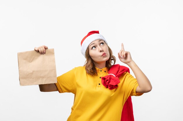 Close up on young pretty woman wearing Christmas hat isolated