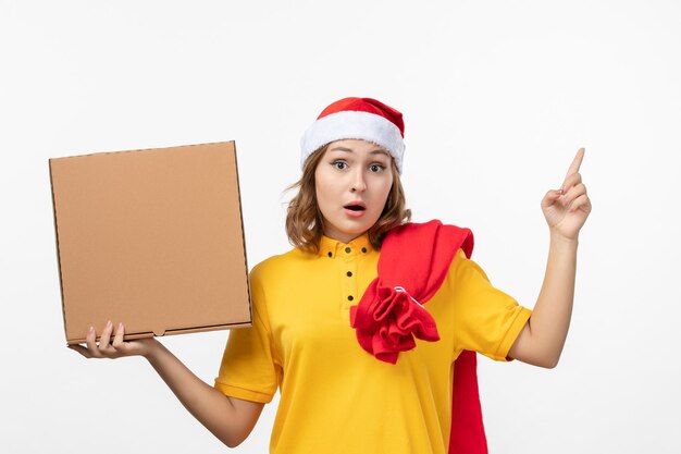 Close up on young pretty woman wearing Christmas hat isolated