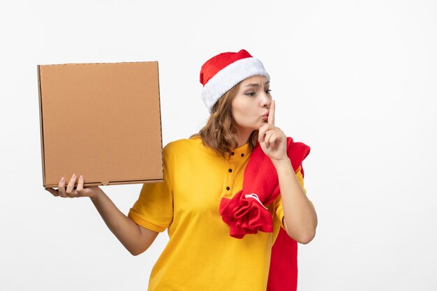 Close up on young pretty woman wearing Christmas hat isolated