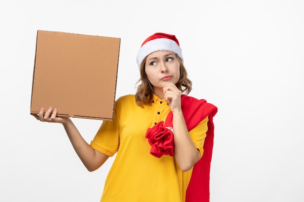 Close up on young pretty woman wearing Christmas hat isolated