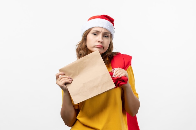 Close up on young pretty woman wearing Christmas hat isolated