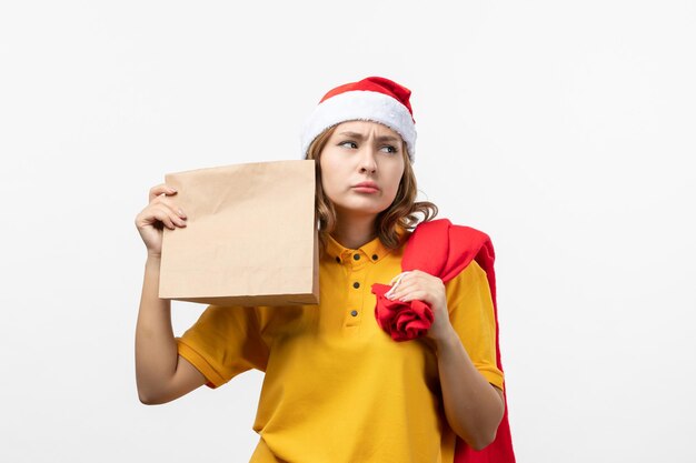 Close up on young pretty woman wearing Christmas hat isolated