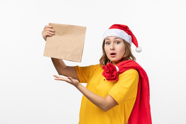 Close up on young pretty woman wearing Christmas hat isolated