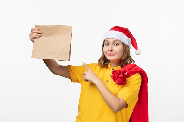 Close up on young pretty woman wearing Christmas hat isolated