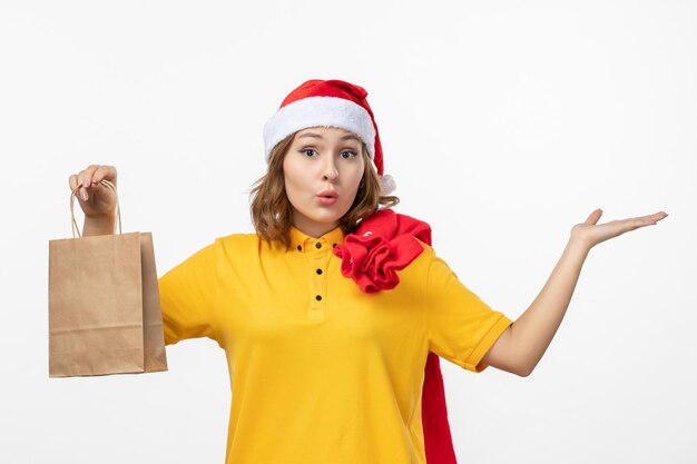 Close up on young pretty woman wearing Christmas hat isolated