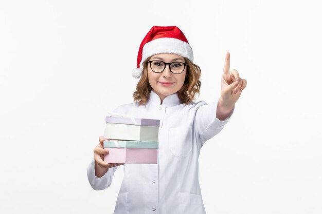 Close up on young pretty woman wearing Christmas hat isolated