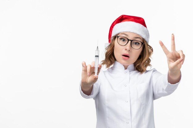 Close up on young pretty woman wearing Christmas hat isolated