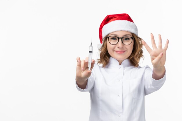 Close up on young pretty woman wearing Christmas hat isolated