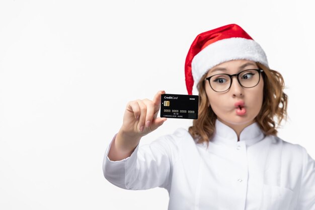 Close up on young pretty woman wearing Christmas hat isolated