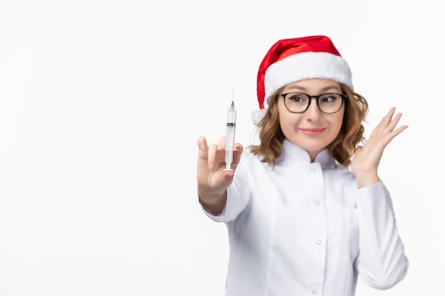 Close up on young pretty woman wearing Christmas hat isolated