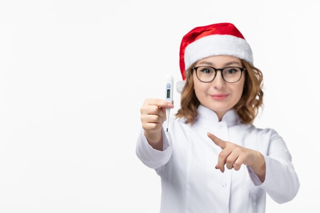 Close up on young pretty woman wearing Christmas hat isolated