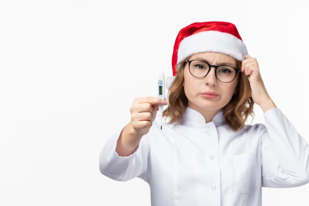 Close up on young pretty woman wearing Christmas hat isolated