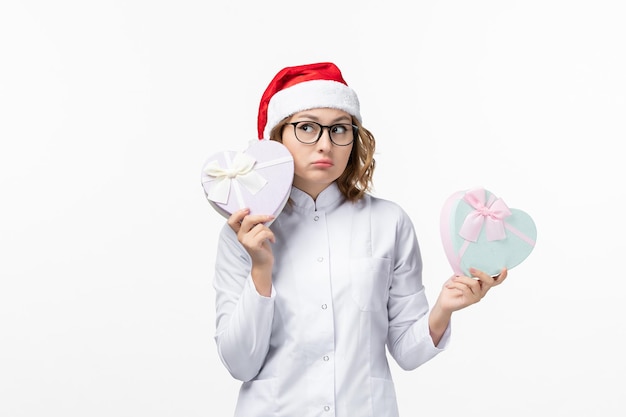 Close up on young pretty woman wearing Christmas hat isolated