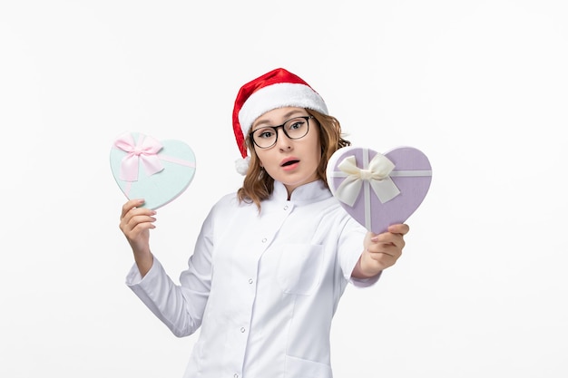 Close up on young pretty woman wearing Christmas hat isolated