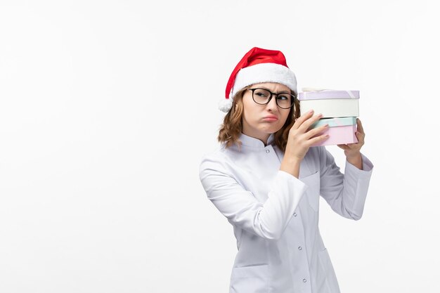 Close up on young pretty woman wearing Christmas hat isolated