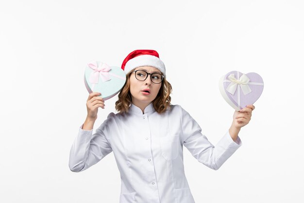 Close up on young pretty woman wearing Christmas hat isolated