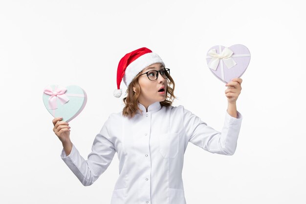 Close up on young pretty woman wearing Christmas hat isolated