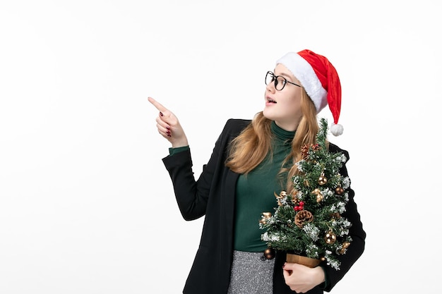 Close up on young pretty woman wearing Christmas hat isolated