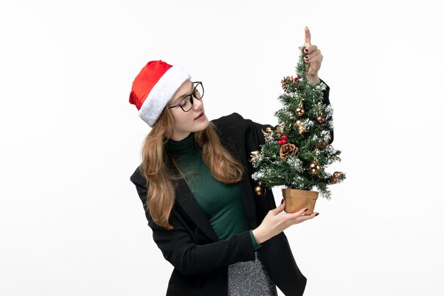 Close up on young pretty woman wearing Christmas hat isolated