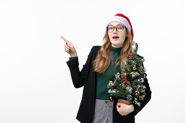 Close up on young pretty woman wearing Christmas hat isolated