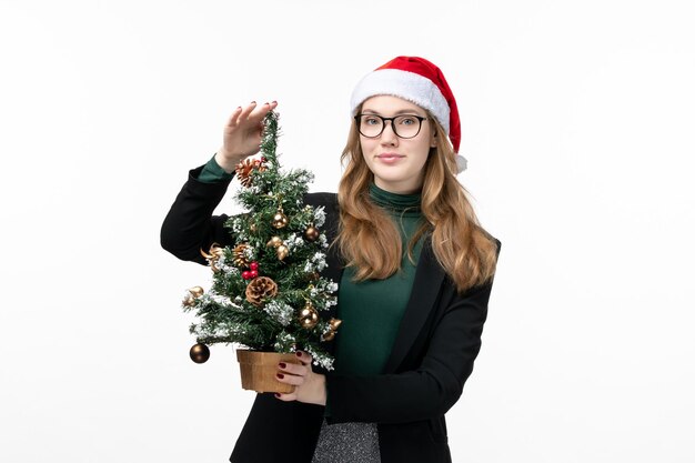 Close up on young pretty woman wearing Christmas hat isolated