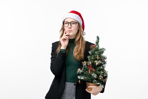 Close up on young pretty woman wearing Christmas hat isolated