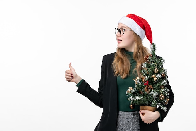 Close up on young pretty woman wearing Christmas hat isolated