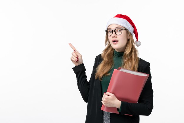 Close up on young pretty woman wearing Christmas hat isolated