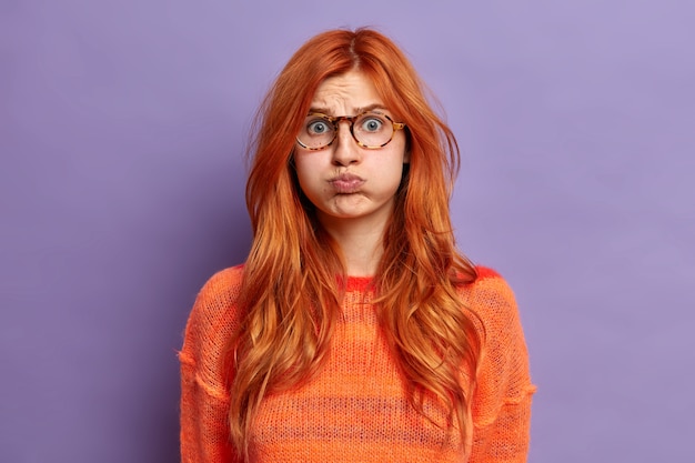 Close up on young redhead woman gesturing