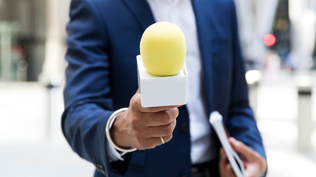 Free Photo close up on young reporter describing a situation live