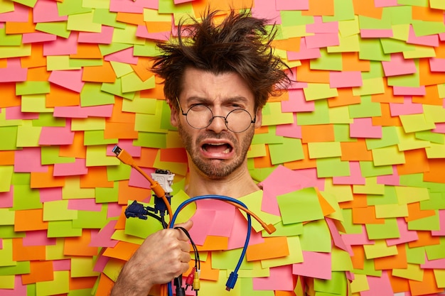 Free Photo close up on young student surrounded by sticky notes