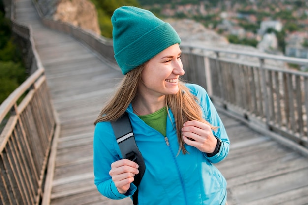 Close-up young traveller with beanie enjoying vacation