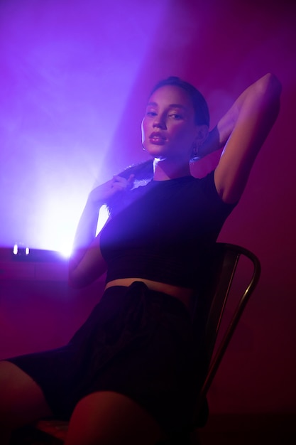 Free Photo close up on young woman posing in dramatic light