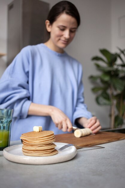 Close up on young woman preparing food for eating