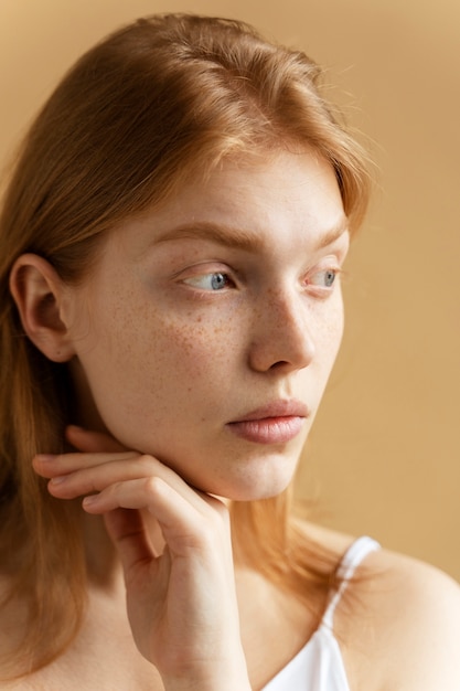 Close up young woman with freckles