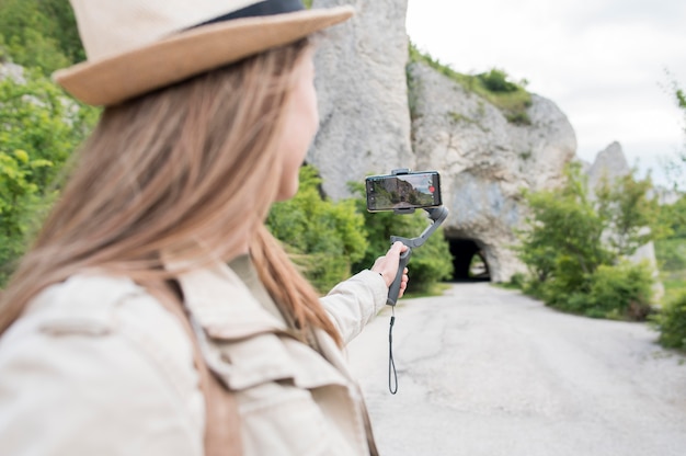 Free Photo close-up young woman with hat looking away