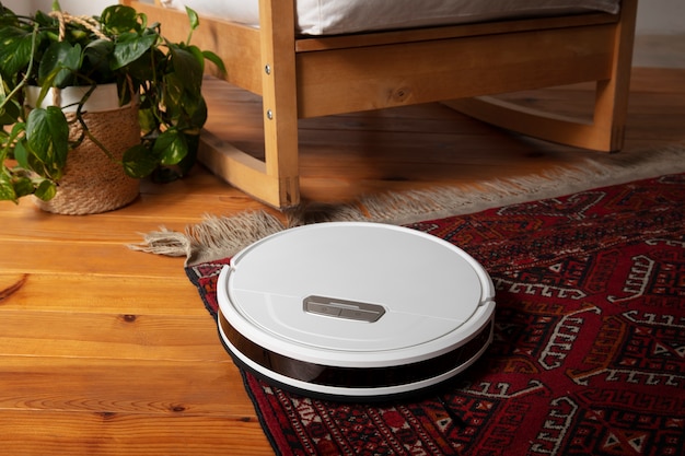 Free photo close upon  robot vacuum cleaner indoors